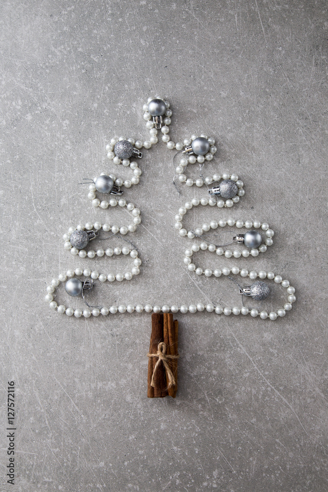 Christmas tree of pearls, cinnamon sticks and Christmas balls. T Christmas tree of pearls, cinnamon sticks and Christmas balls. T