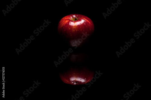 Red apple isolated on black background