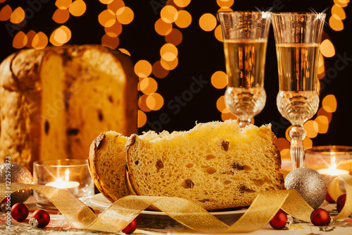Sliced italian panettone and sparkling wine