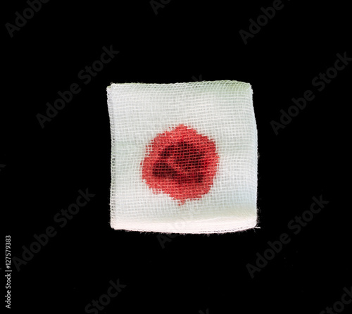 Photos Bandage gauze with blood on black background