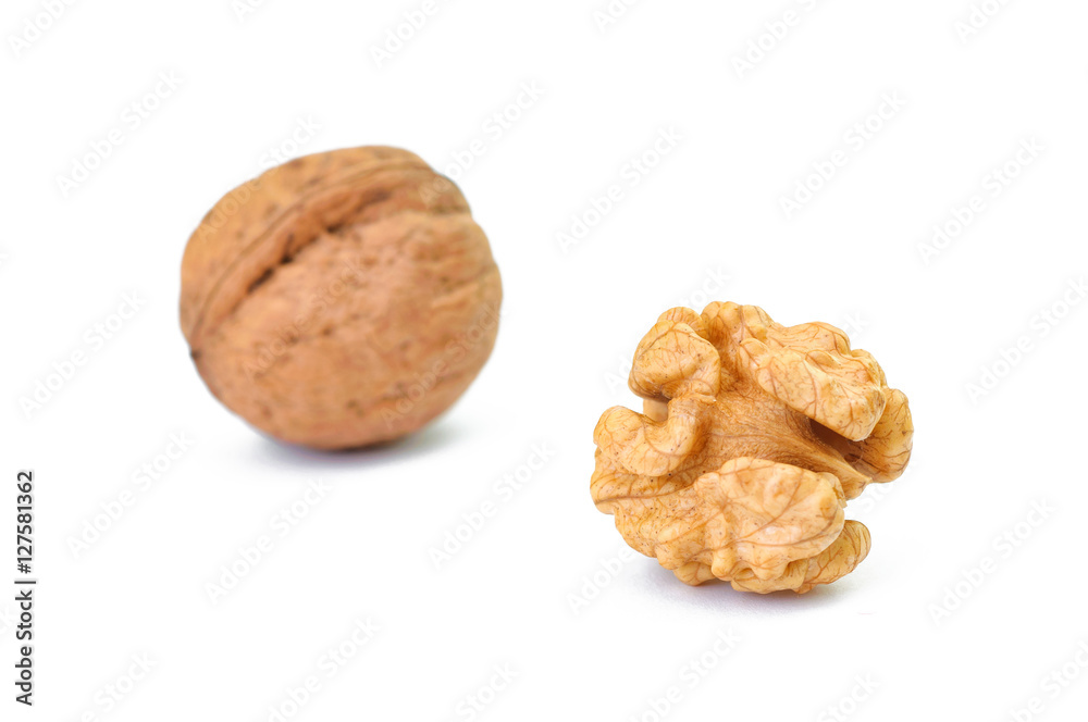 whole and cracked walnut isolated on the white background whole and cracked walnut isolated on the white background