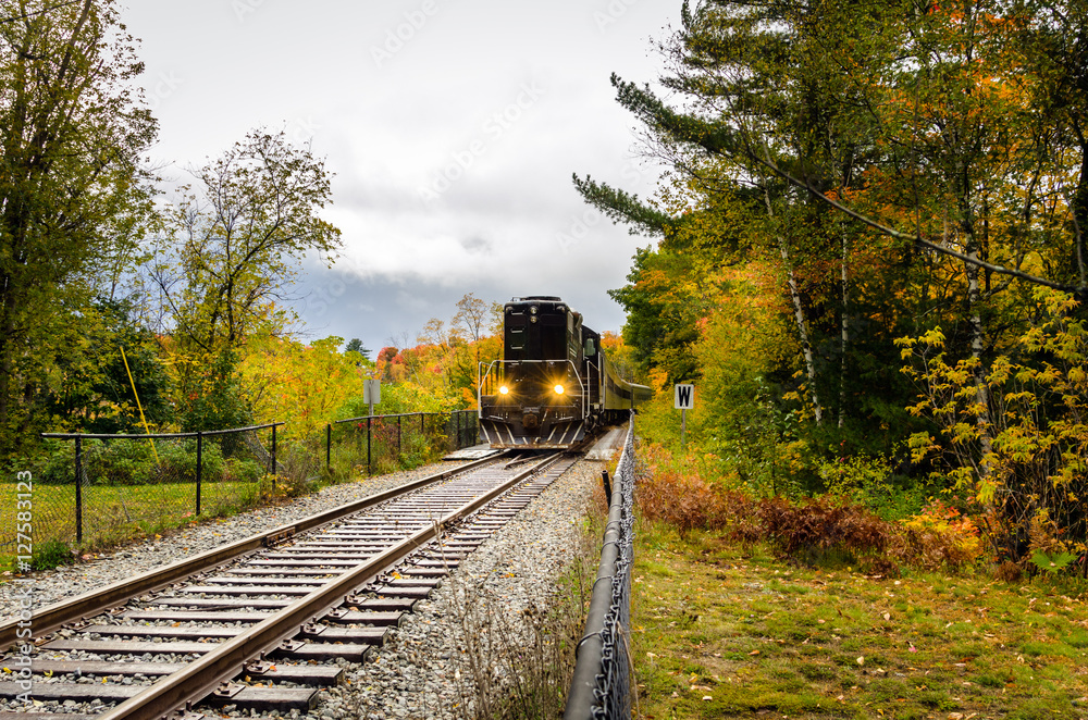 Passenger Train Travelling Through the Countryside on a Rainy Autumn Day Passenger Train Travelling Through the Countryside on a Rainy Autumn Day