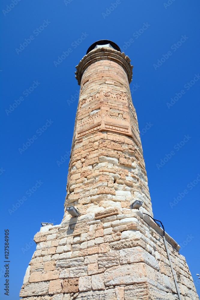 View of the lighthouse at the entrance to the harbour, Rethymno, Crete, Greece.