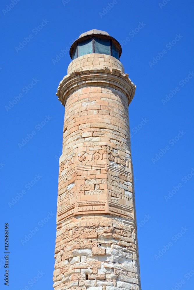 View of the lighthouse at the entrance to the harbour, Rethymno, Crete, Greece.