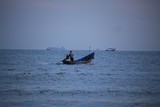 fisherman in boat on sea the morning