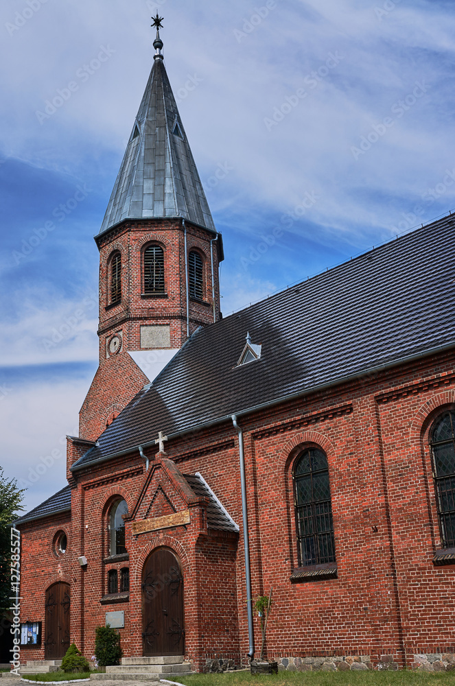 Gothic parish church with belfry in Poland.