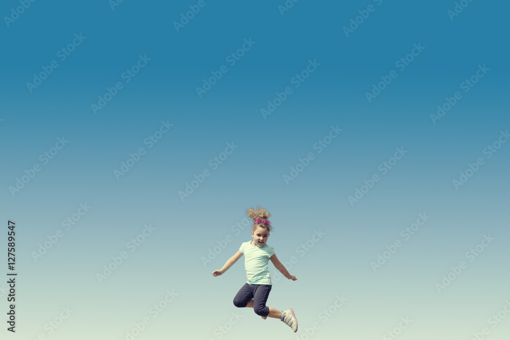 Jumping little girl