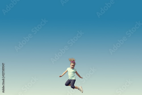 Jumping little girl