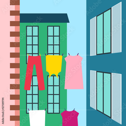 Laundry drying Vector illustration Laundry drying on the clothesline stretched between the buildings Flat design