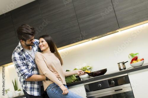 Young couple preparing meal
