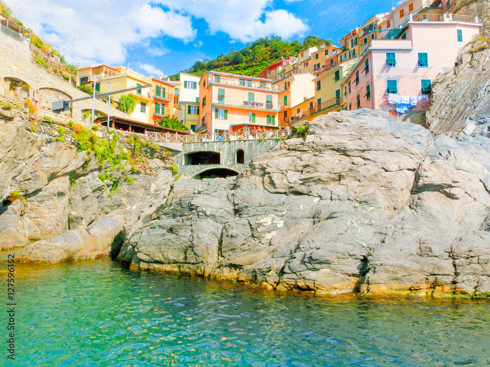 Manarola, Cinque Terre, Italy - Colorful traditional houses on a rock over Mediterranean sea
