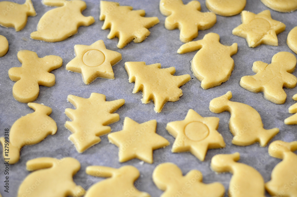 Sweet shortbread dough fingers on white background.