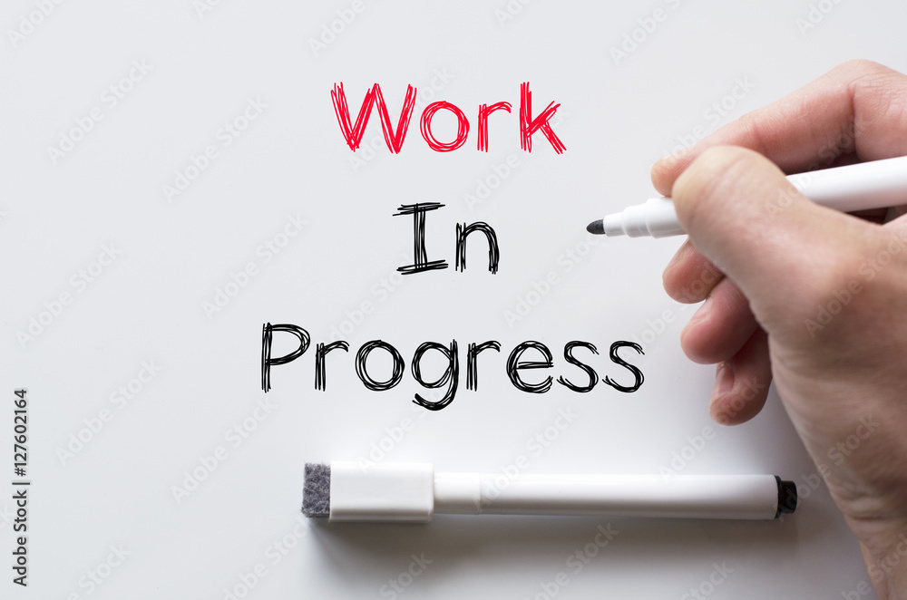 Work in progress written on whiteboard Work in progress written on whiteboard