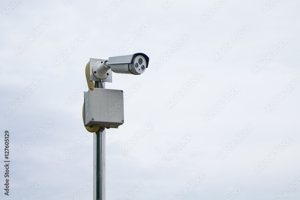 Surveillance camera on the sky while the sky's overcast, looks like it's going to rain Surveillance camera on the sky while the sky's overcast, looks like it's going to rain