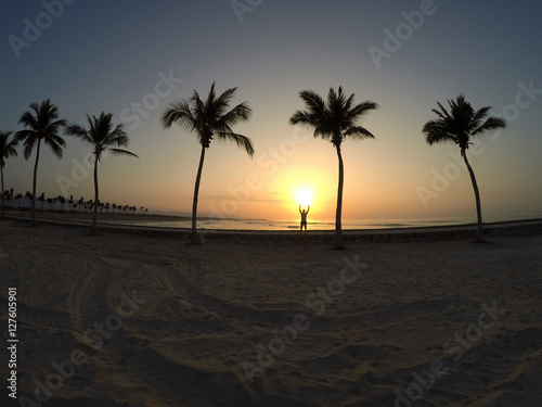 Man practicing yoga ocean beach salalah Oman 6