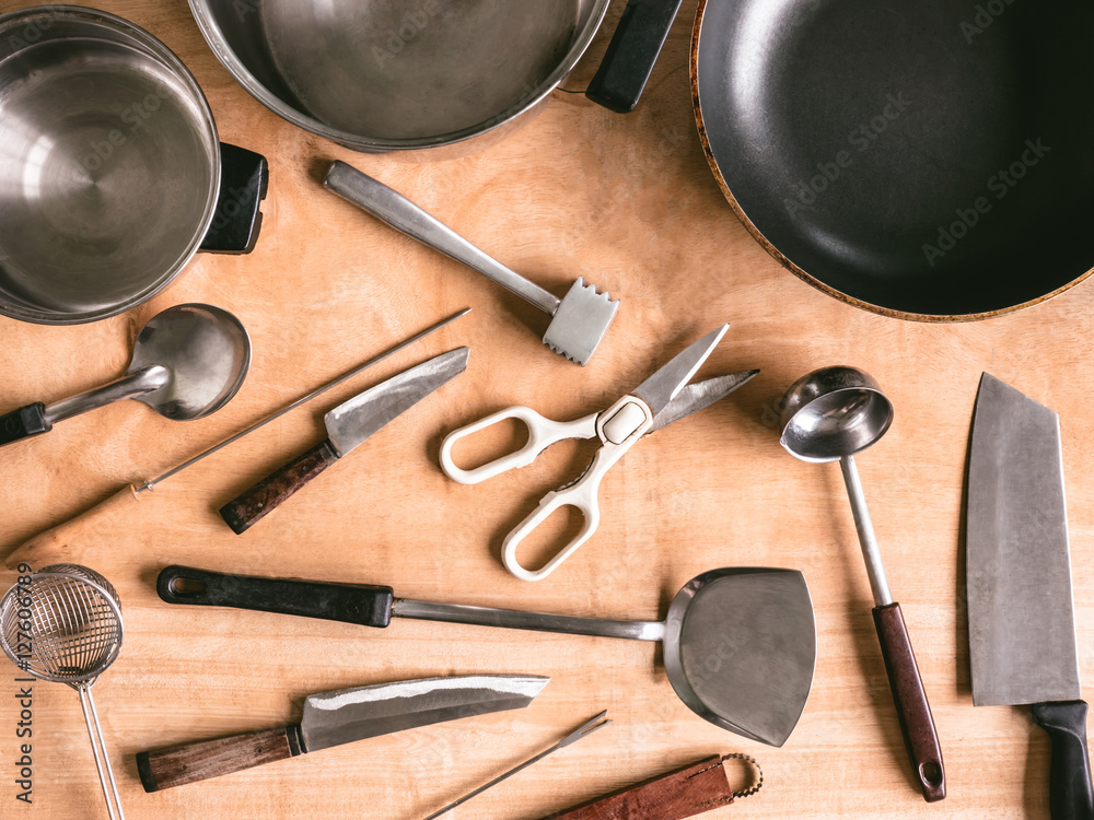 Kitchen utensils on wooden table background. Kitchen utensils on wooden table background.