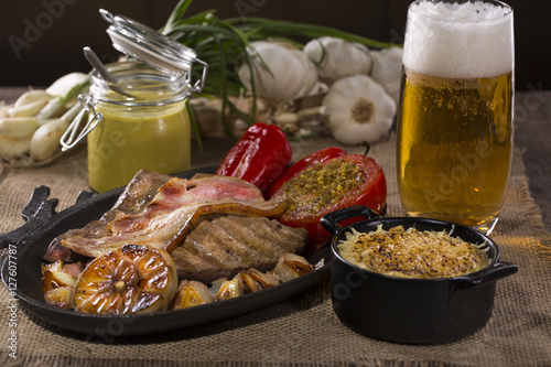 Dish with rustic snacks on rough canvas photo