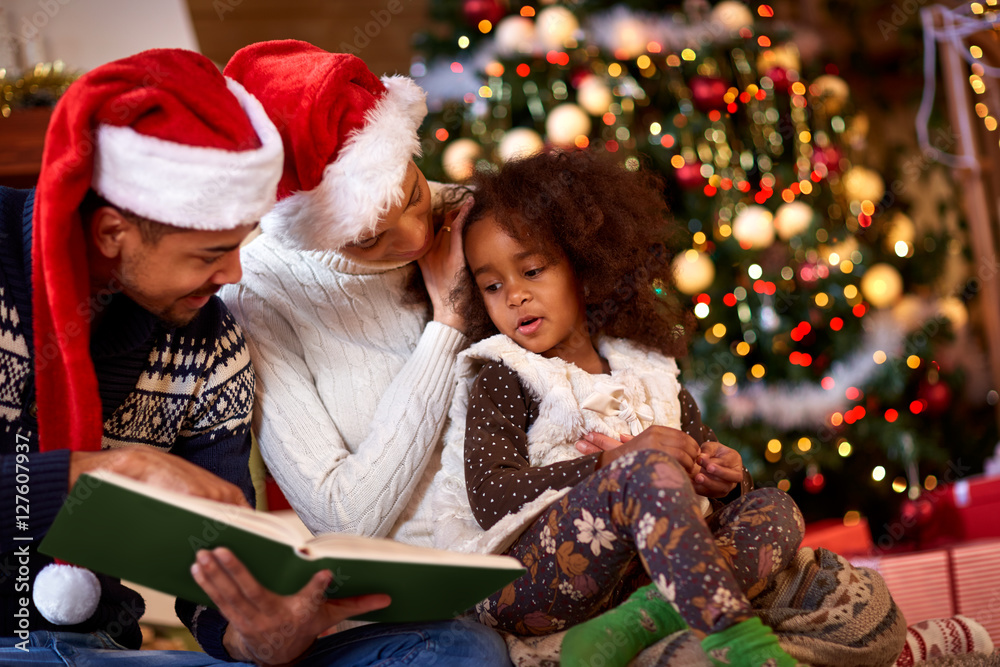 Afro American young family having Christmas moments Afro American young family having Christmas moments