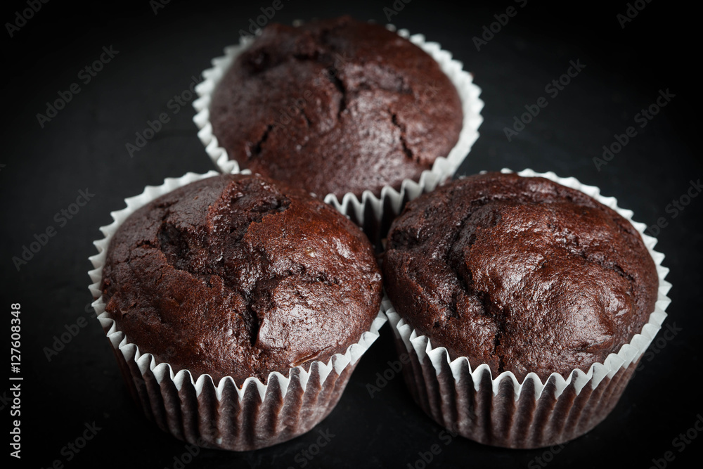 Chocolate muffin on dark background. Stock-Foto | Adobe Stock
