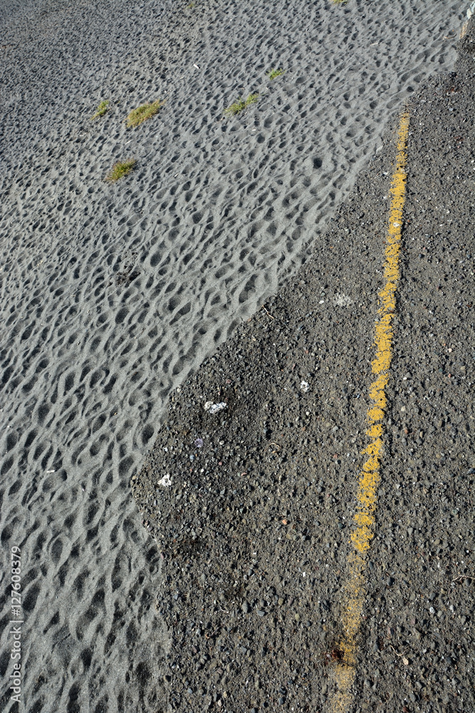 Fototapeta premium Broken road with sand background