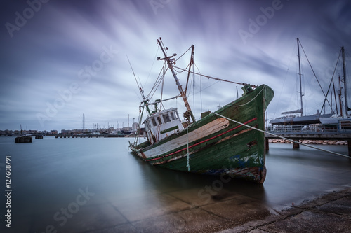 Old fishing boat aground