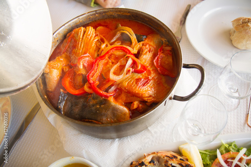 portuguese dish caldeirada in iron pot photo
