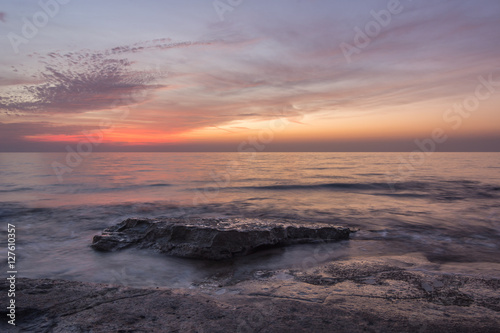 Pastel colors and bright red after sunset at Nahariya Beach