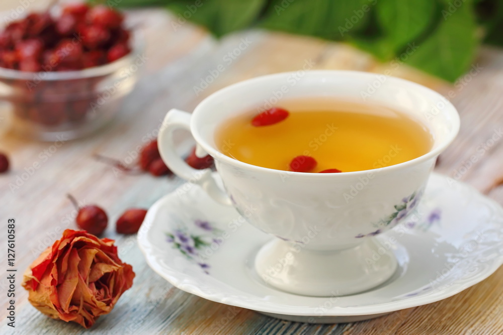 Tea with rosehip on a table. Useful drink for health. Herbal tea. Tea with rosehip on a table. Useful drink for health. Herbal tea.