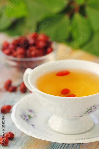 Tea with rosehip on a table. Useful drink for health. Herbal tea.