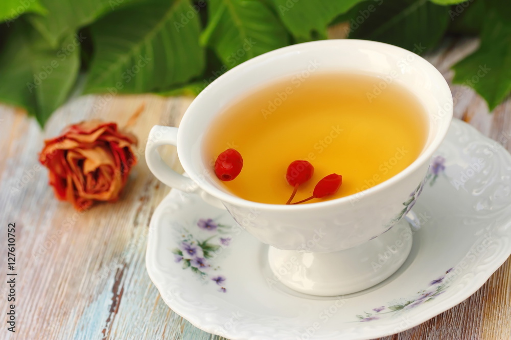 Tea with rosehip on a table. Useful drink for health. Herbal tea. Tea with rosehip on a table. Useful drink for health. Herbal tea.