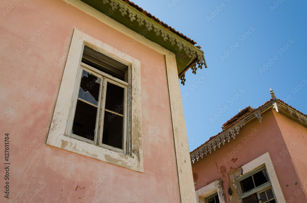 Large pink ruined mansion from Portuguese colonial times in Angola