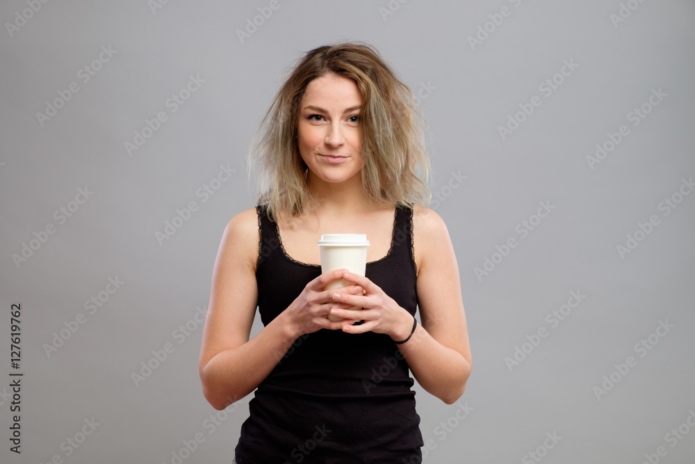 Woman enjoying hot drink in disposable paper cup Woman enjoying hot drink in disposable paper cup