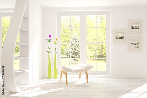 White room with chair and green landscape in window. Scandinavian interior design © AntonSh