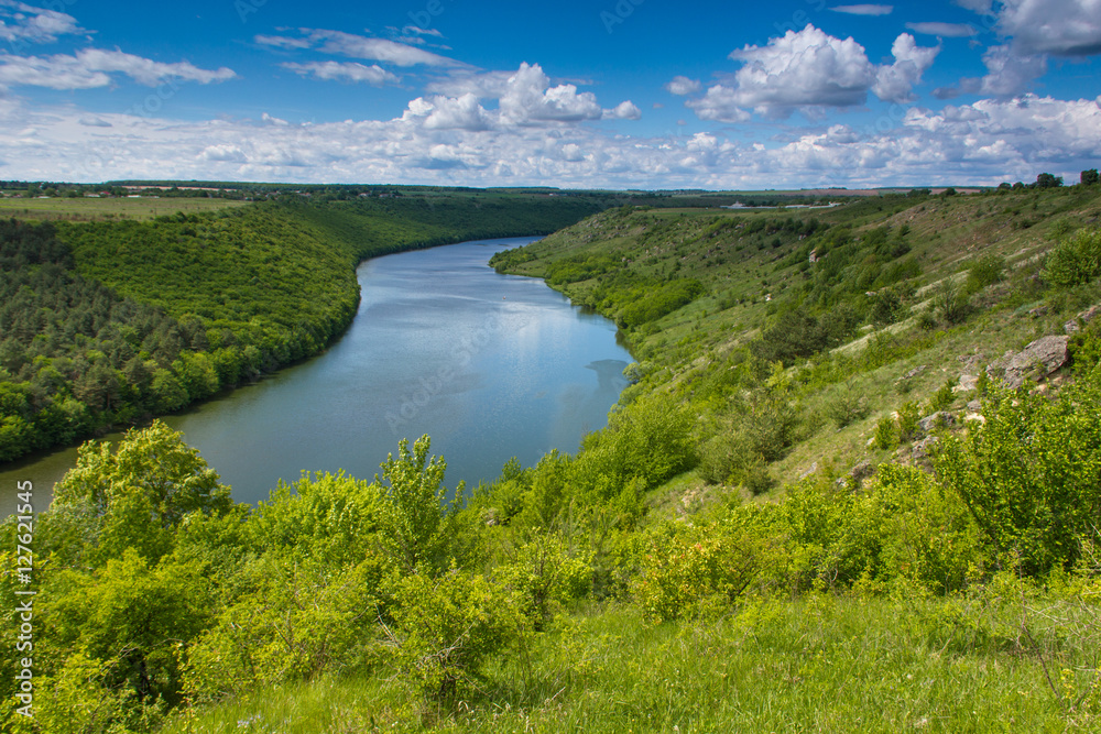 The scenic summer landscape. View of bend of the river. Panoramic view from the hill. 