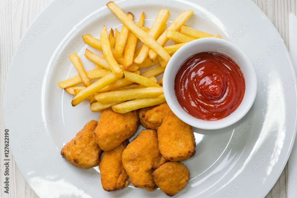 Chicken nuggets with french fries and ketchup Chicken nuggets with french fries and ketchup