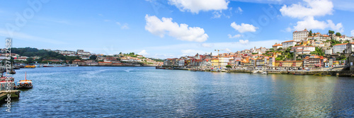 View of the historic city of Porto, Portugal with the Dom Luis bridge and blue sky / Ancient city Porto,metallic Dom Luis bridge.