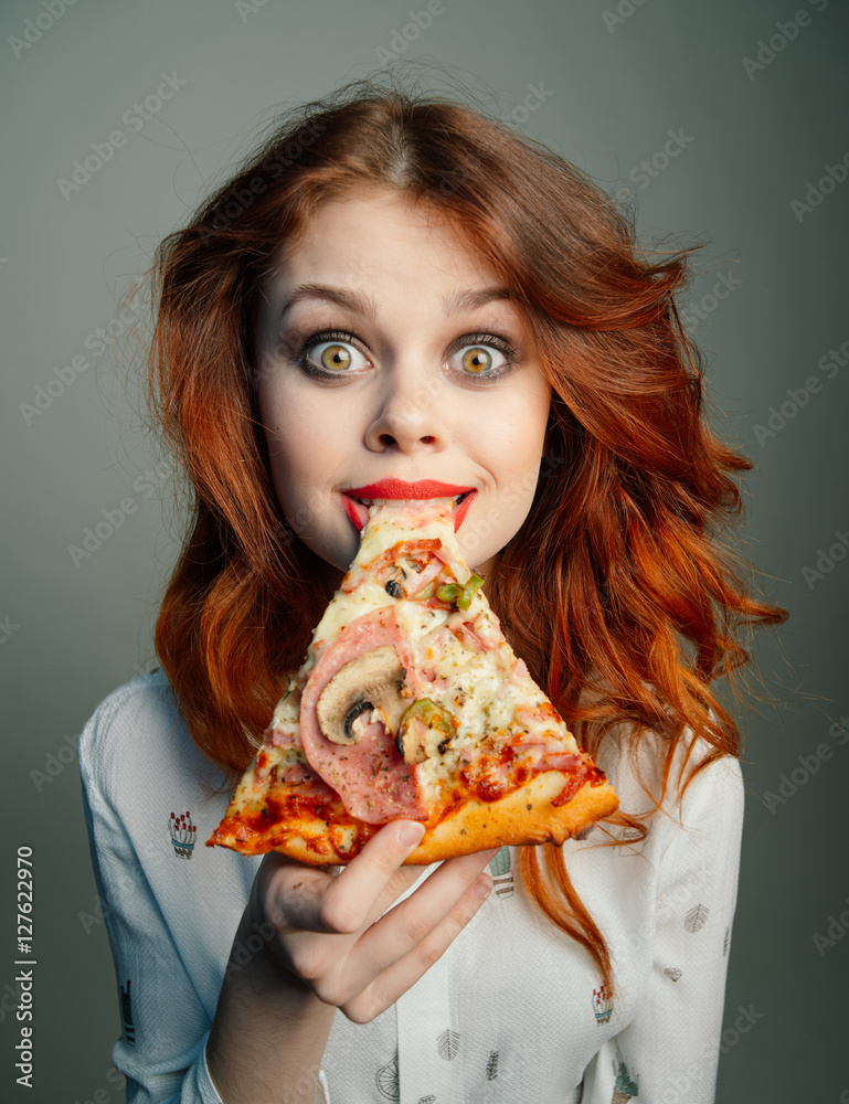 Woman with pizza.  Woman eating pizza
