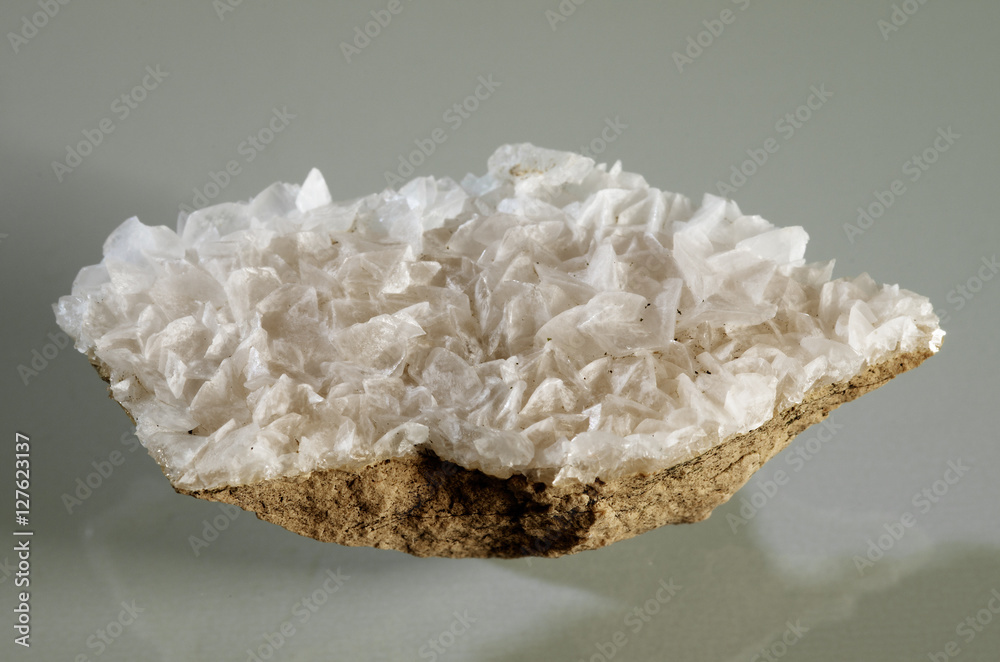 Calcite white crystal formation over a rock substrate Calcite white crystal formation over a rock substrate