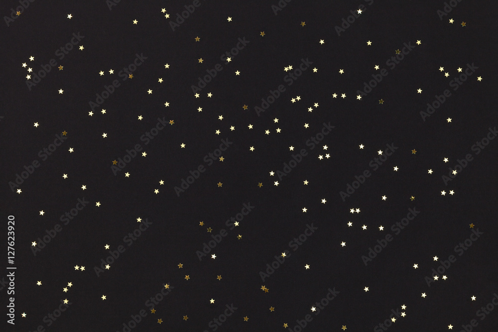 Golden stars on black background. Golden stars on black background.