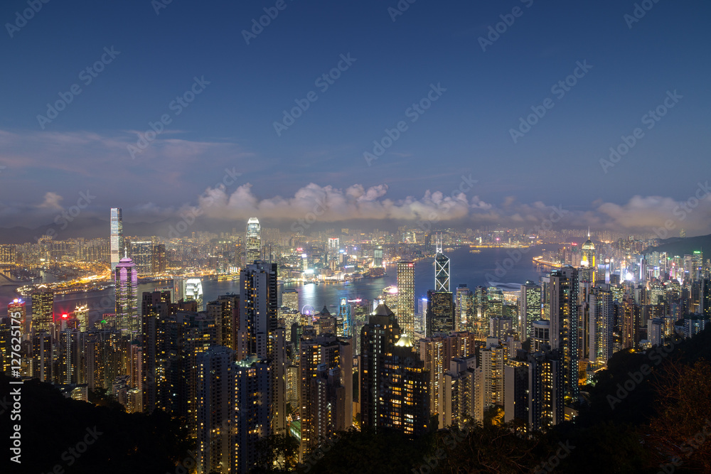 Fototapeta premium Hong Kong's famous skyline viewed from the Victoria Peak in the evening. Copy space.