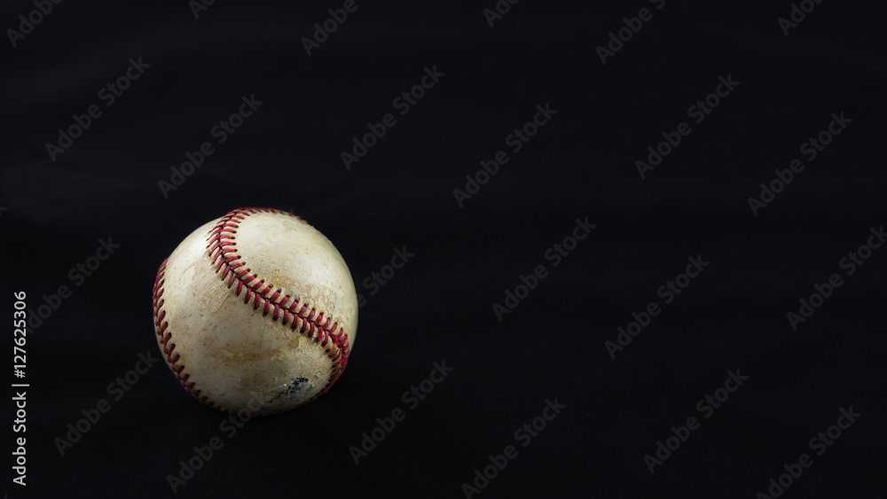 Baseball on a black background.