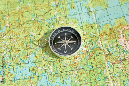 Symbols of travel - map with compass. © sergunt