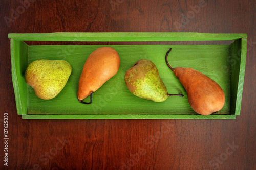 pears fruits on old wooden table background