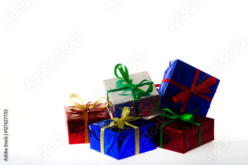 Multi-colored gift boxes on white background