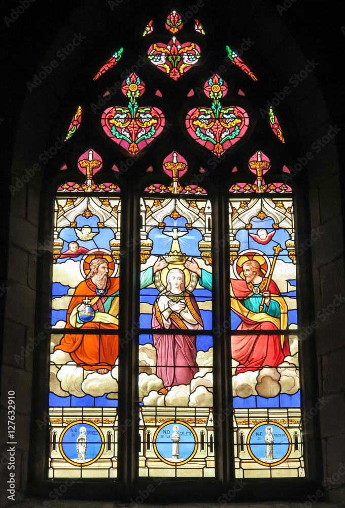 Iffendic, France - September 9, 2016: Stained glass window in th