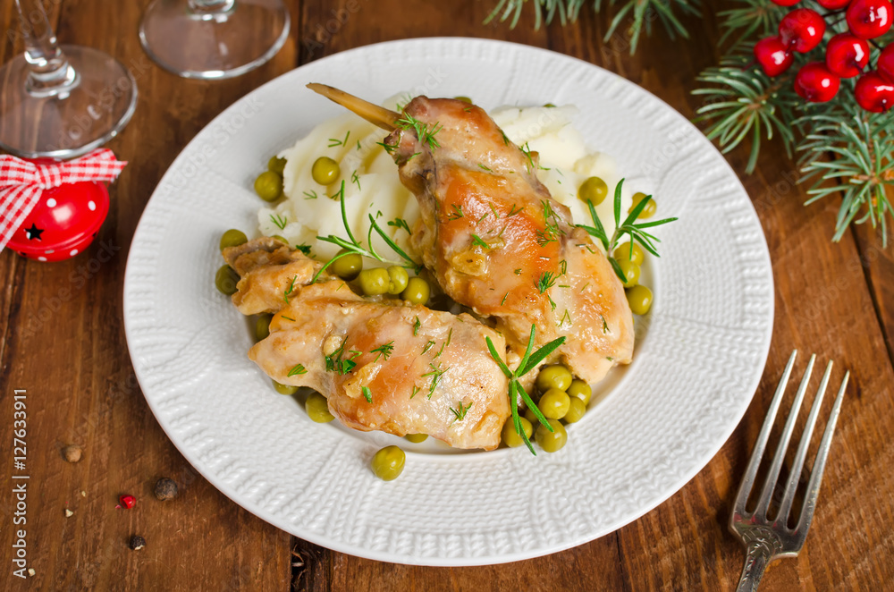 Oven Baked rabbit legs with potatoes and rosemary Oven Baked rabbit legs with potatoes and rosemary
