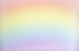 horizontal blank background image of pastel red and yellow and blue and pink rainbow great for copy or text space and great for greeting cards.