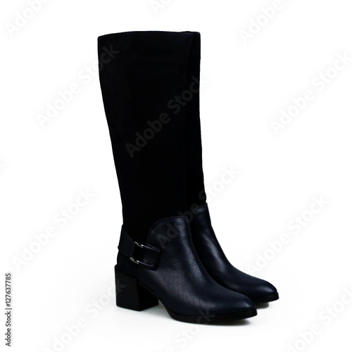 Closeup of blue suede boot against white background