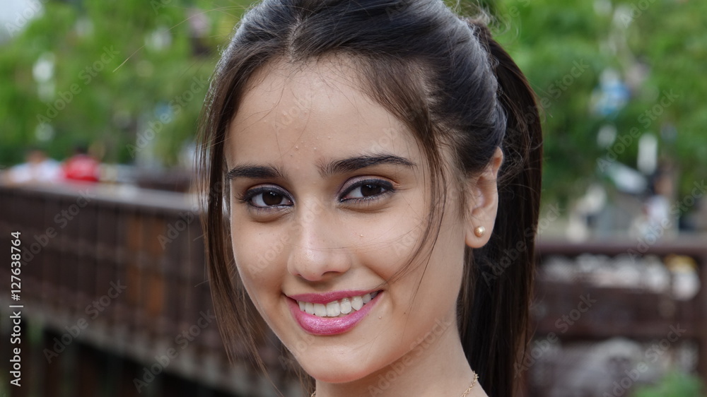 Fototapeta premium Smiling Teen Female At Park
