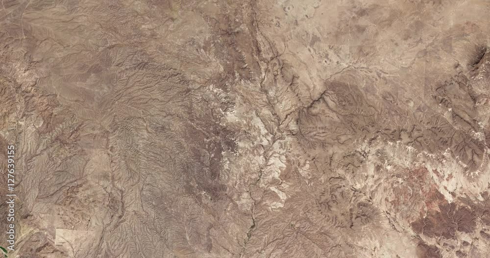 High-altitude overflight aerial of rocky desert near the Mexico/Texas border. Clip loops and is reversible. Elements of this image furnished by NASA High-altitude overflight aerial of rocky desert near the Mexico/Texas border. Clip loops and is reversible. Elements of this image furnished by NASA